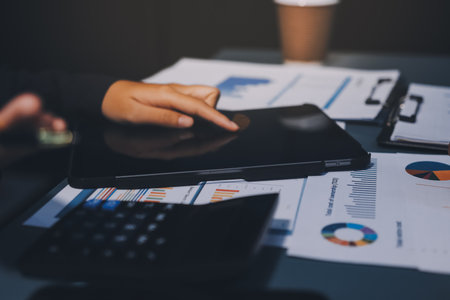 Business Documents, Auditor businesswoman checking searching document legal prepare paperwork or report for analysis TAX time,accountant Documents data contract partner deal in workplace officeの写真素材