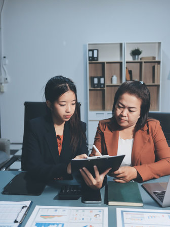 Business Documents, Auditor businesswoman checking searching document legal prepare paperwork or report for analysis TAX time,accountant Documents data contract partner deal in workplace officeの写真素材