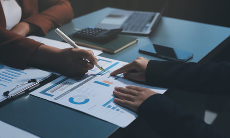 Business Documents, Auditor businesswoman checking searching document legal prepare paperwork or report for analysis TAX time,accountant Documents data contract partner deal in workplace officeの写真素材