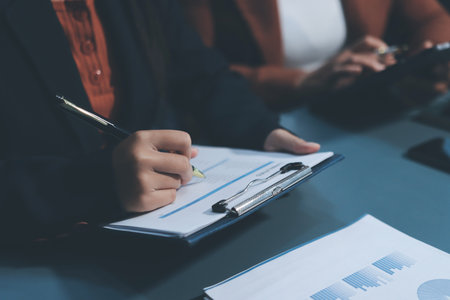 Business Documents, Auditor businesswoman checking searching document legal prepare paperwork or report for analysis TAX time,accountant Documents data contract partner deal in workplace officeの写真素材