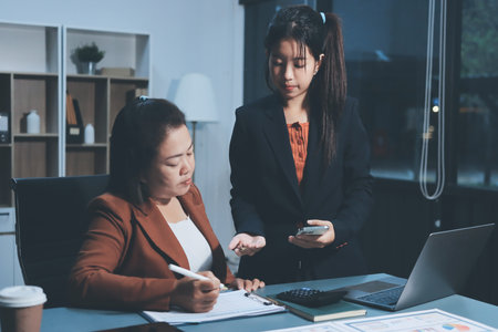 Business Documents, Auditor businesswoman checking searching document legal prepare paperwork or report for analysis TAX time,accountant Documents data contract partner deal in workplace officeの写真素材