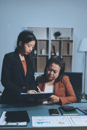 Business Documents, Auditor businesswoman checking searching document legal prepare paperwork or report for analysis TAX time,accountant Documents data contract partner deal in workplace officeの写真素材