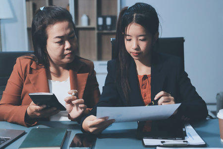 Business Documents, Auditor businesswoman checking searching document legal prepare paperwork or report for analysis TAX time,accountant Documents data contract partner deal in workplace officeの写真素材