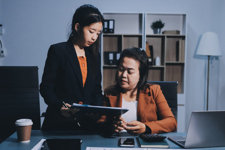 Business Documents, Auditor businesswoman checking searching document legal prepare paperwork or report for analysis TAX time,accountant Documents data contract partner deal in workplace officeの写真素材