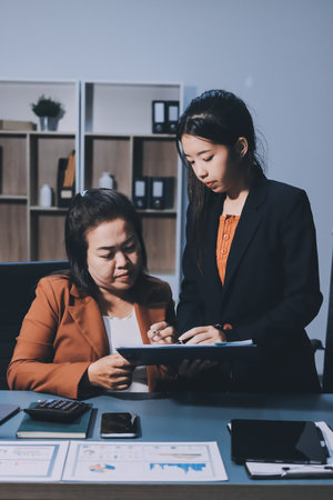 Business Documents, Auditor businesswoman checking searching document legal prepare paperwork or report for analysis TAX time,accountant Documents data contract partner deal in workplace officeの写真素材