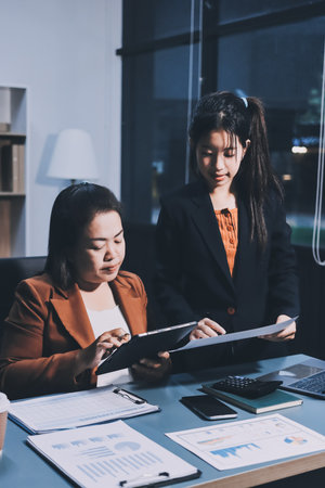 Business Documents, Auditor businesswoman checking searching document legal prepare paperwork or report for analysis TAX time,accountant Documents data contract partner deal in workplace officeの写真素材