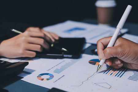 Business Documents, Auditor businesswoman checking searching document legal prepare paperwork or report for analysis TAX time,accountant Documents data contract partner deal in workplace officeの写真素材