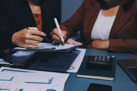 Business Documents, Auditor businesswoman checking searching document legal prepare paperwork or report for analysis TAX time,accountant Documents data contract partner deal in workplace officeの写真素材