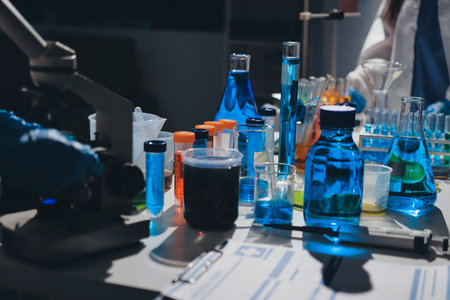 Scientist pipetting medical samples into microplate in laboratoryの写真素材