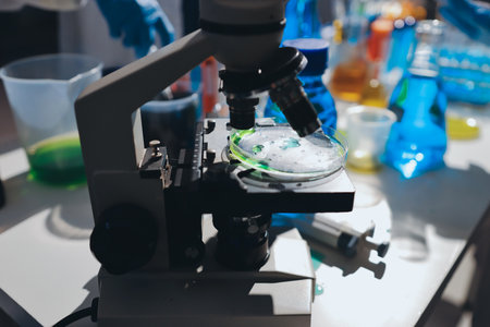 Scientist pipetting medical samples into microplate in laboratoryの写真素材