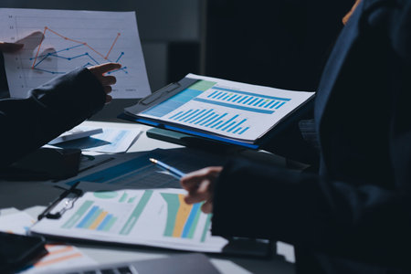 Group of business women working on a financial data expenses document.の写真素材