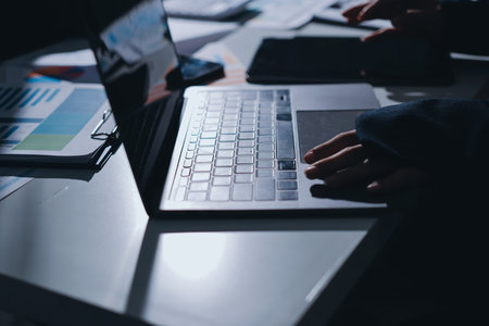 Group of business women working on a financial data expenses document.