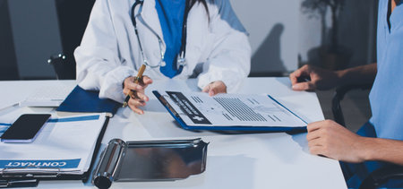 Young brunette woman having consultation at doctor office during