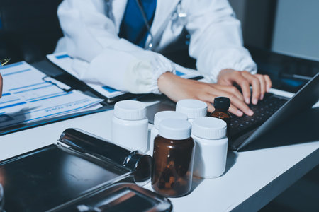 Male and female doctors are having a meeting in a hospital room.の写真素材