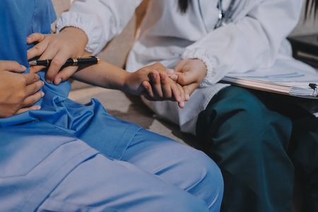 Doctor reassuring patient woman while sitting at the desk in clinic, just hands. Medicine and best...