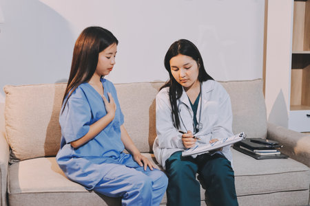 Patient filling the papers of insurance at the hospitalの写真素材