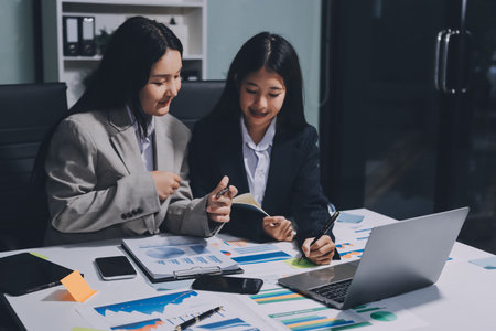 Accounting company provide finance and taxation planning for profitable cash flow, Auditor and accountant team working in office, analyze financial data and accounting record with calculator.Insightの写真素材