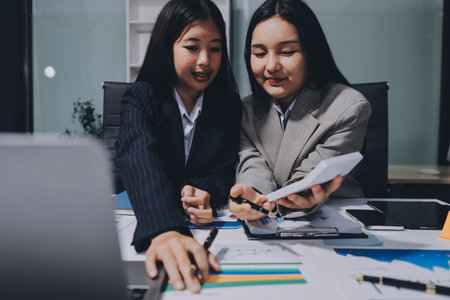 Accounting company provide finance and taxation planning for profitable cash flow, Auditor and accountant team working in office, analyze financial data and accounting record with calculator.Insightの写真素材