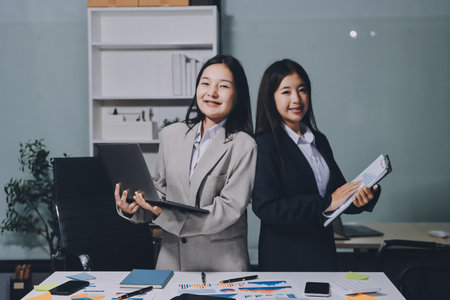 Accounting company provide finance and taxation planning for profitable cash flow, Auditor and accountant team working in office, analyze financial data and accounting record with calculator.Insightの写真素材