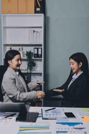 Accounting company provide finance and taxation planning for profitable cash flow, Auditor and accountant team working in office, analyze financial data and accounting record with calculator.Insightの写真素材