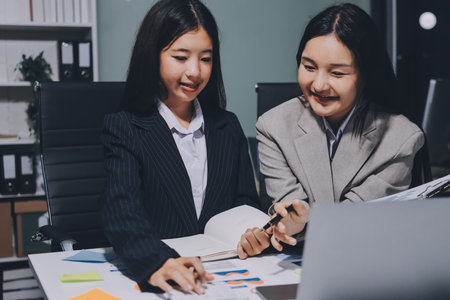 Accounting company provide finance and taxation planning for profitable cash flow, Auditor and accountant team working in office, analyze financial data and accounting record with calculator.Insightの写真素材