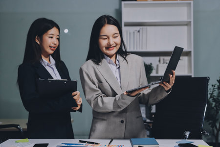 Accounting company provide finance and taxation planning for profitable cash flow, Auditor and accountant team working in office, analyze financial data and accounting record with calculator.Insightの写真素材