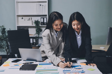 Accounting company provide finance and taxation planning for profitable cash flow, Auditor and accountant team working in office, analyze financial data and accounting record with calculator.Insightの写真素材