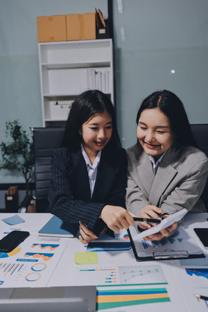 Accounting company provide finance and taxation planning for profitable cash flow, Auditor and accountant team working in office, analyze financial data and accounting record with calculator.Insightの写真素材