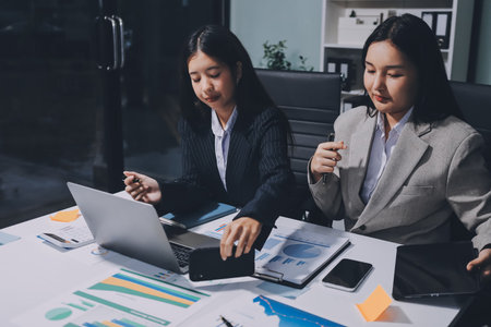 Accounting company provide finance and taxation planning for profitable cash flow, Auditor and accountant team working in office, analyze financial data and accounting record with calculator.Insightの写真素材