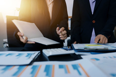 Team of business people working together in the meeting room office,
teamwork background charts and graphs banner, double exposure successful teamwork,business planning concept.の写真素材