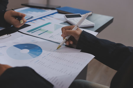 Team of business people working together in the meeting room office,
teamwork background charts and graphs banner, double exposure successful teamwork,business planning concept.の写真素材