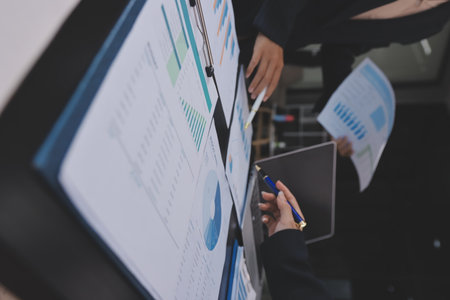 Team of business people working together in the meeting room office,
teamwork background charts and graphs banner, double exposure successful teamwork,business planning concept.の写真素材