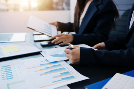 Team of business people working together in the meeting room office,
teamwork background charts and graphs banner, double exposure successful teamwork,business planning concept.の写真素材