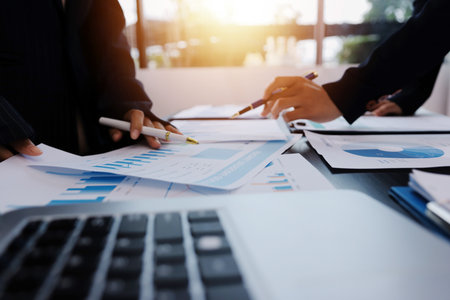 Team of business people working together in the meeting room office,
teamwork background charts and graphs banner, double exposure successful teamwork,business planning concept.の写真素材