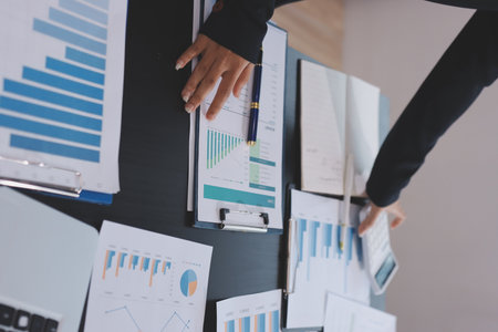 Team of business people working together in the meeting room office,
teamwork background charts and graphs banner, double exposure successful teamwork,business planning concept.の写真素材
