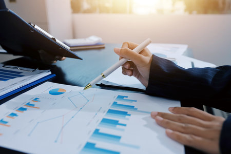 Team of business people working together in the meeting room office,
teamwork background charts and graphs banner, double exposure successful teamwork,business planning concept.の写真素材