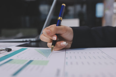Team of business people working together in the meeting room office,
teamwork background charts and graphs banner, double exposure successful teamwork,business planning concept.の写真素材