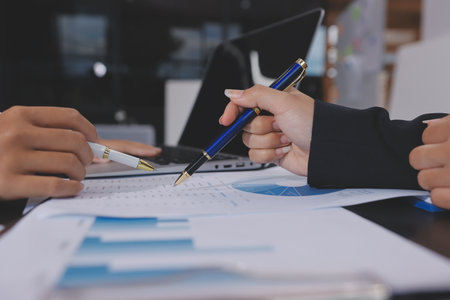 Team of business people working together in the meeting room office,
teamwork background charts and graphs banner, double exposure successful teamwork,business planning concept.の写真素材
