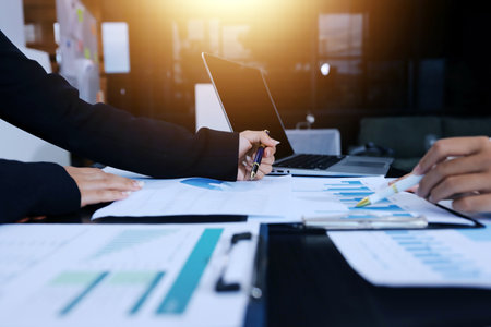 Team of business people working together in the meeting room office,
teamwork background charts and graphs banner, double exposure successful teamwork,business planning concept.の写真素材