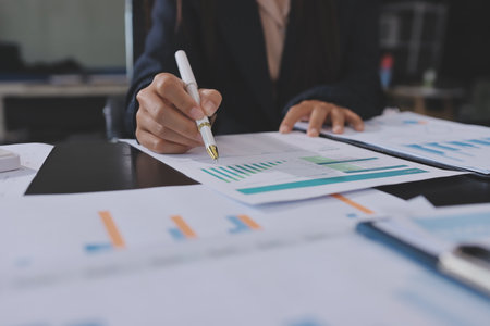 Team of business people working together in the meeting room office,teamwork background charts and graphs banner, double exposure successful teamwork,business planning concept.の写真素材