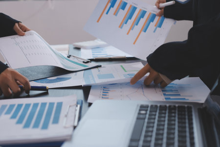 Team of business people working together in the meeting room office,
teamwork background charts and graphs banner, double exposure successful teamwork,business planning concept.の写真素材
