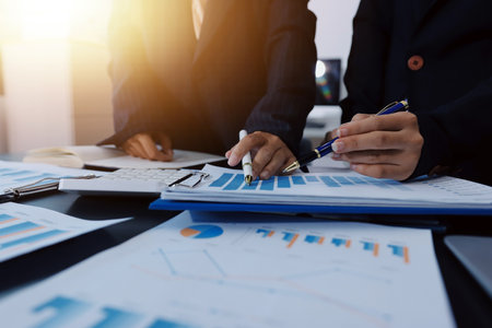 Team of business people working together in the meeting room office,
teamwork background charts and graphs banner, double exposure successful teamwork,business planning concept.の写真素材