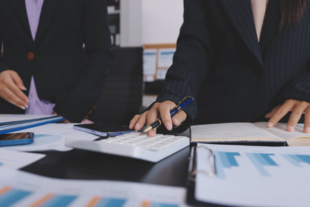 Team of business people working together in the meeting room office,
teamwork background charts and graphs banner, double exposure successful teamwork,business planning concept.の写真素材