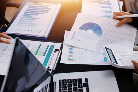 Team of business people working together in the meeting room office,
teamwork background charts and graphs banner, double exposure successful teamwork,business planning concept.の写真素材