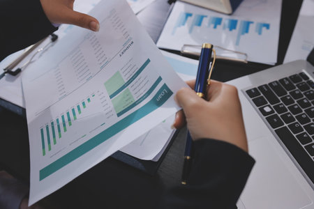 Team of business people working together in the meeting room office,
teamwork background charts and graphs banner, double exposure successful teamwork,business planning concept.の写真素材
