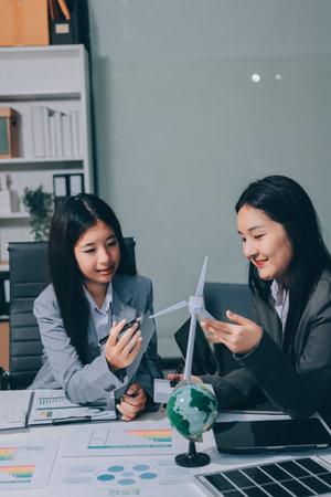 Business team people planning and discussing on recycle reduce reuse policy symbol in office meeting room.の写真素材