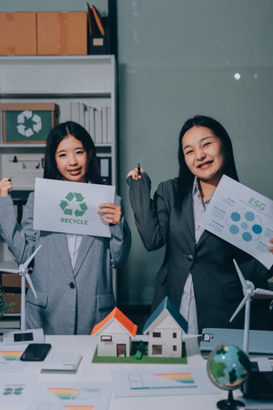 Business team people planning and discussing on recycle reduce reuse policy symbol in office meeting room.の写真素材