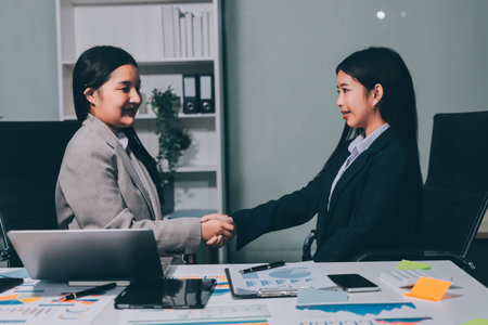 Accounting company provide finance and taxation planning for profitable cash flow, Auditor and accountant team working in office, analyze financial data and accounting record with calculator.Insightの写真素材