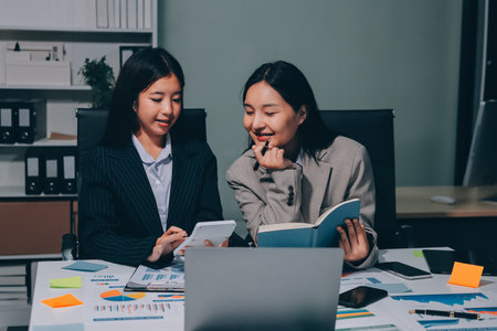 Accounting company provide finance and taxation planning for profitable cash flow, Auditor and accountant team working in office, analyze financial data and accounting record with calculator.Insightの写真素材