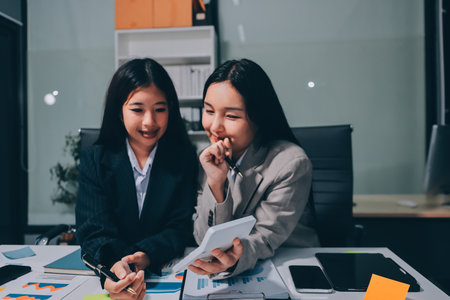 Accounting company provide finance and taxation planning for profitable cash flow, Auditor and accountant team working in office, analyze financial data and accounting record with calculator.Insightの写真素材